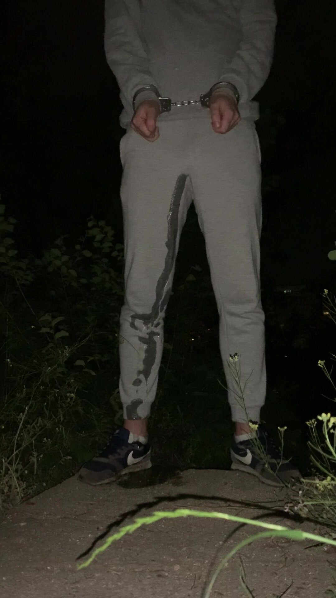 Self pissing outdoors while wearing cuffs