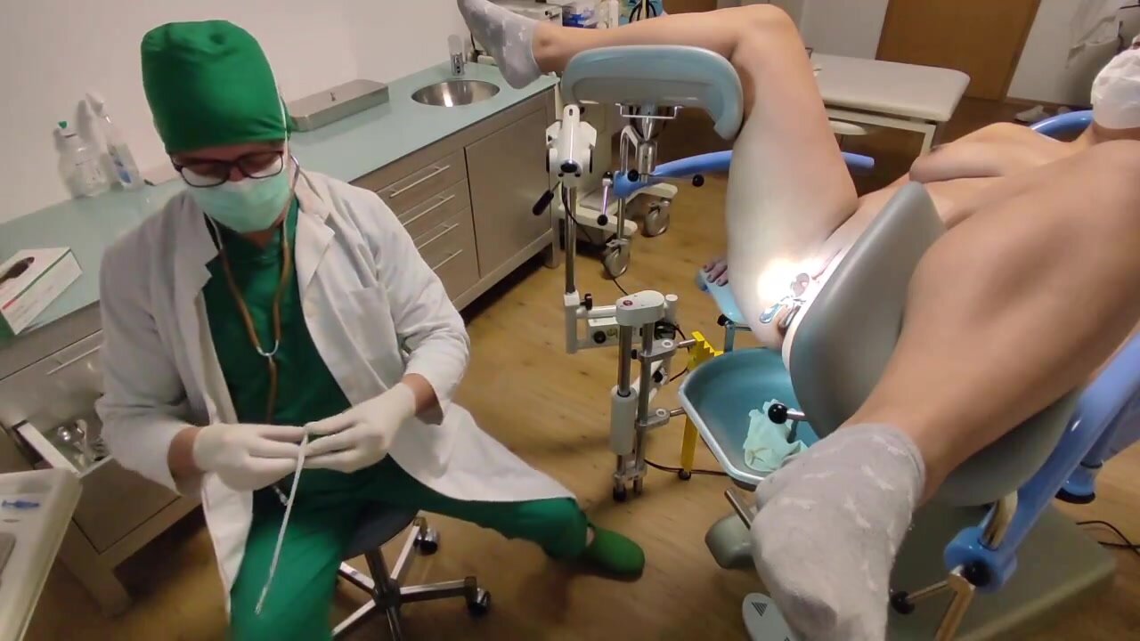 Doc records as he swabs patients vagina