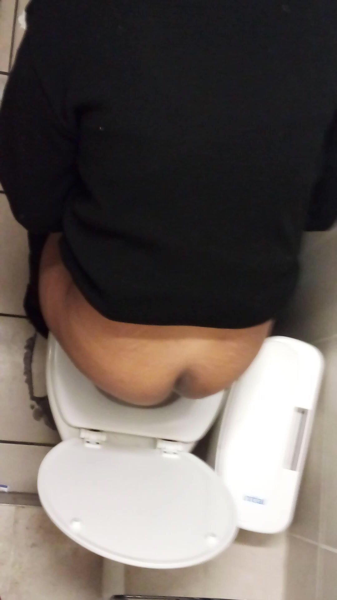 My colleague taking a piss in the toilet