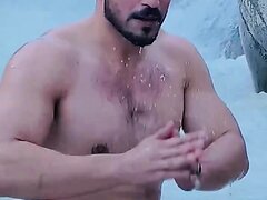 Indian bodybuilder in waterfall