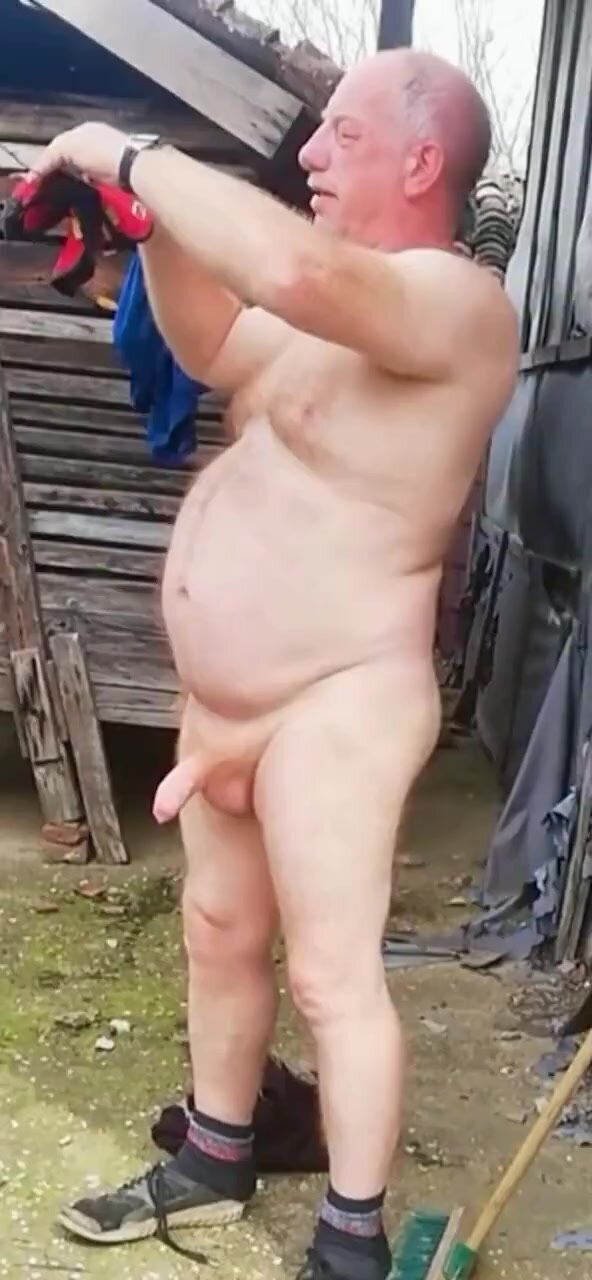 Granddad strips while cleaning yard