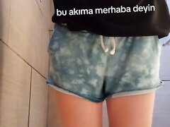 girl pees blue cloudy shorts