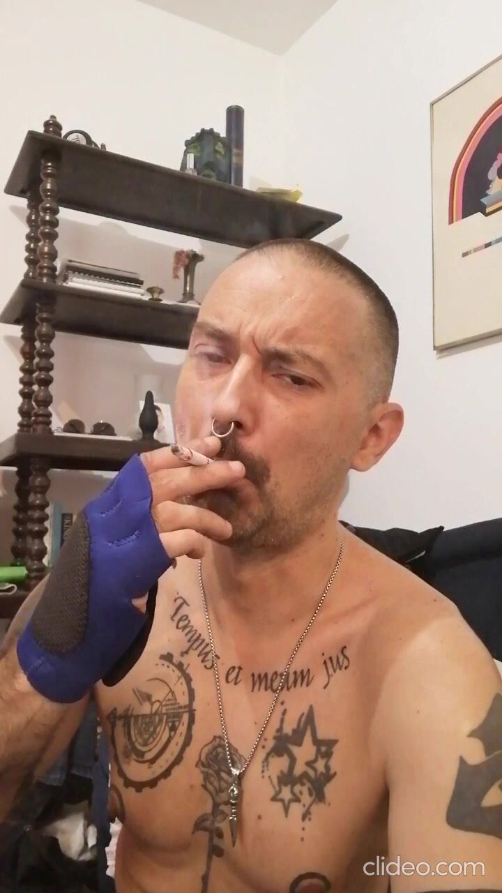Tattooed guy smokes - video 3