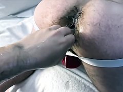Hairy ass in jockstrap gets fisted