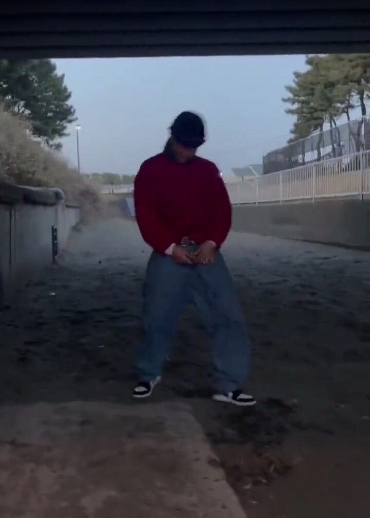 Japanese guy pissing and walking