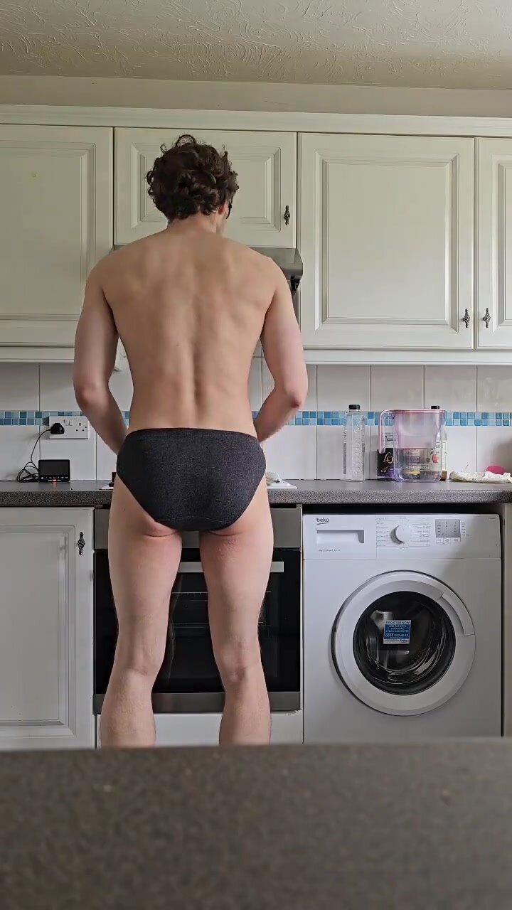 handsome muscle guy poops in briefs while cooking