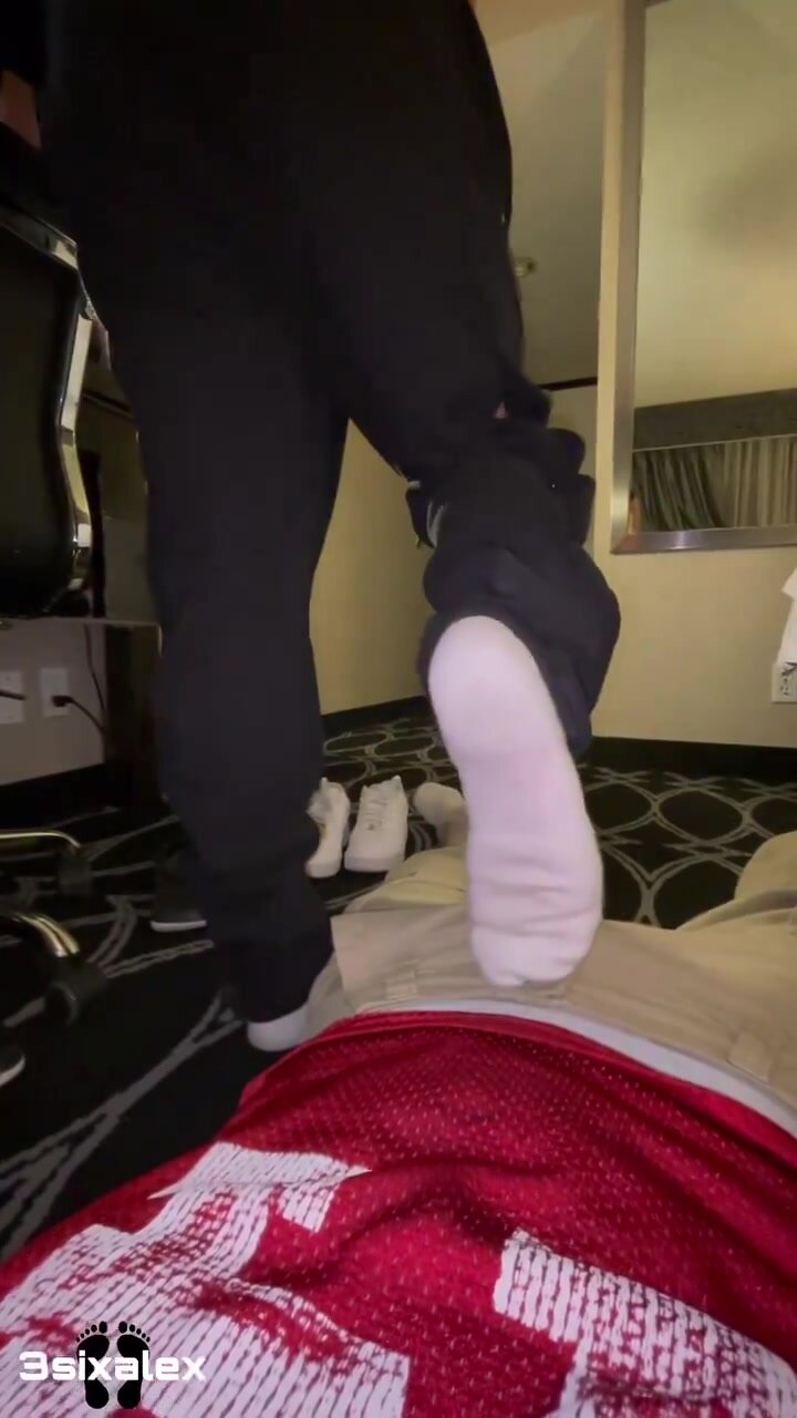 Socked feet caressing cock
