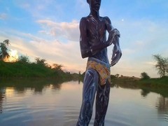 skinny dude in africa bathing with a nice bulge