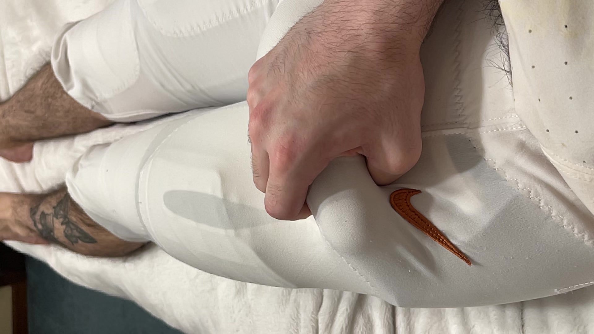 Cumming in Texas Longhorns football pants.