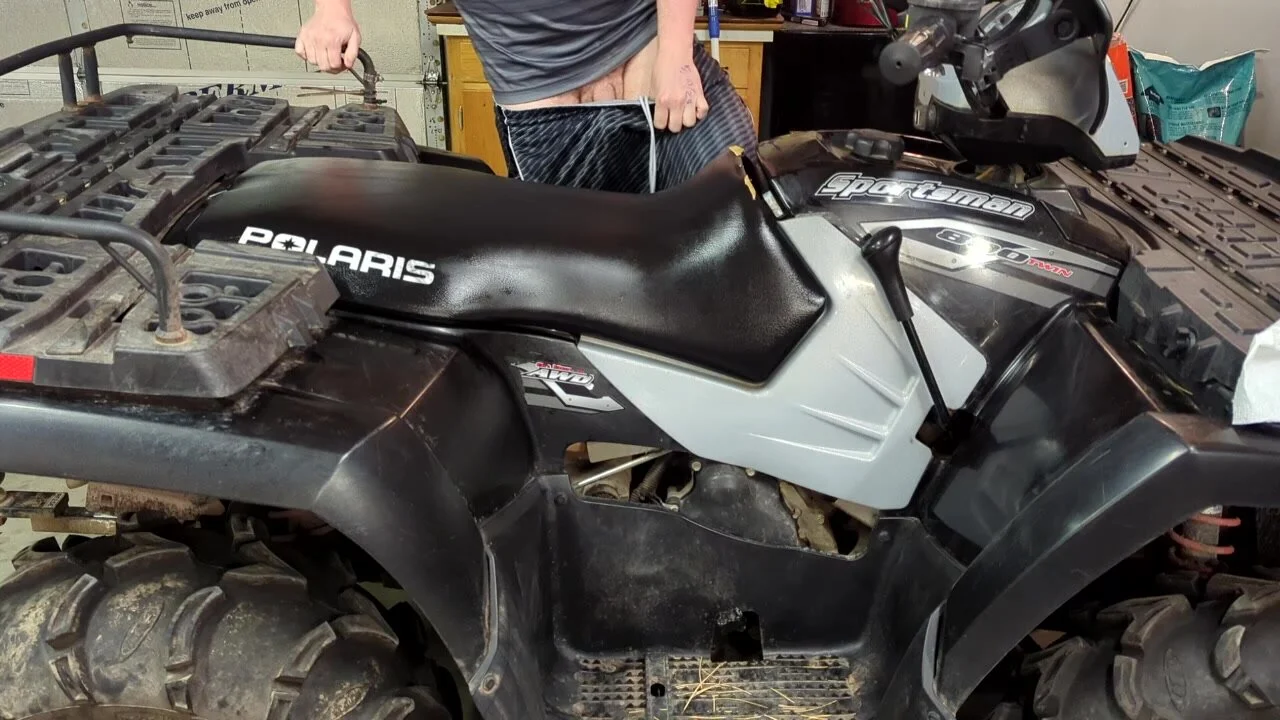 Busting a FAT nut on the 4 wheeler in the garage - ThisVid.com