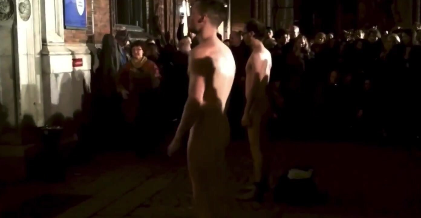 Men strip in front of crowd