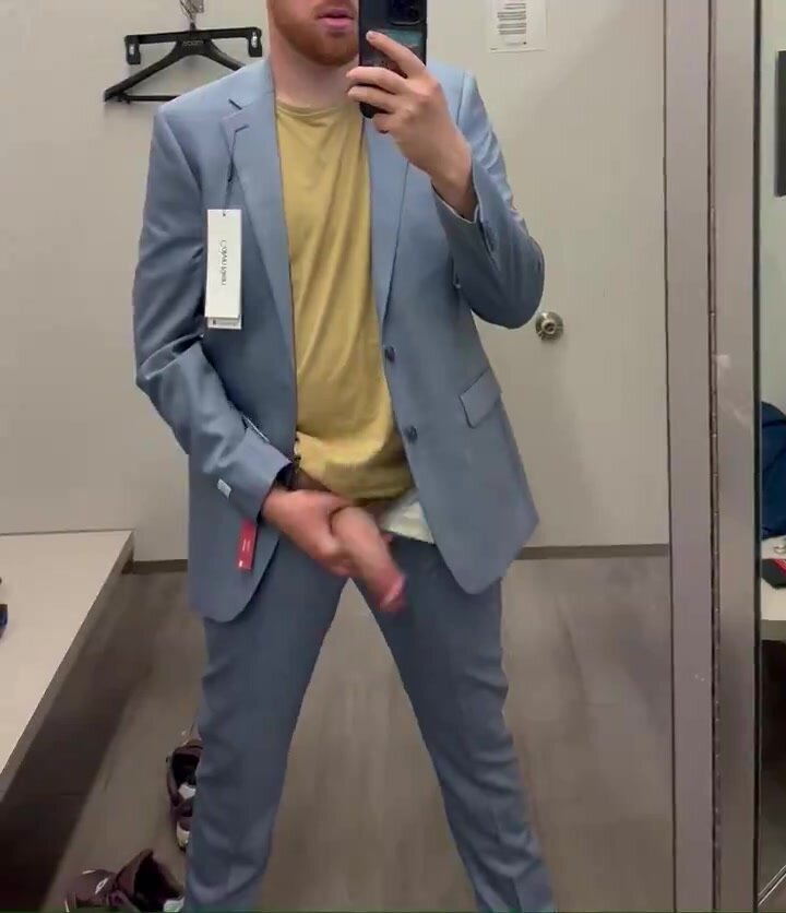 Big-dicked stud jerking off in a dressing room