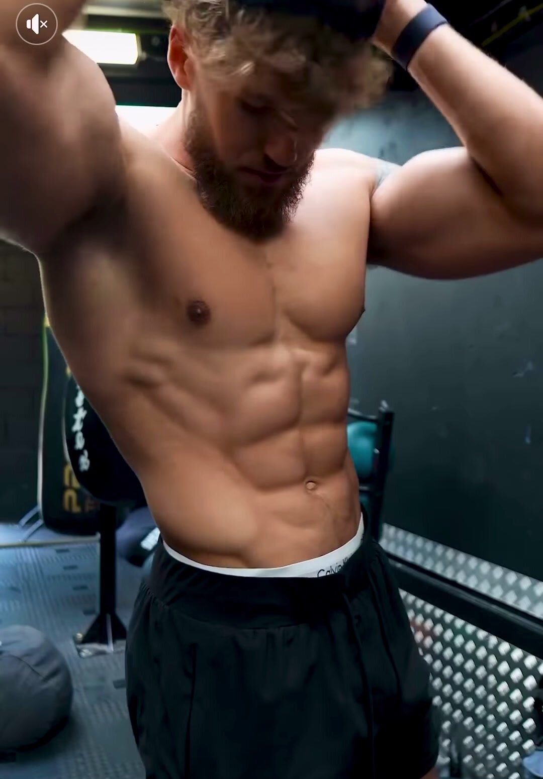Muscular sexy blond guy showing abs and outie
