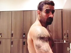 Muscular hung latino stripping in lockerroom
