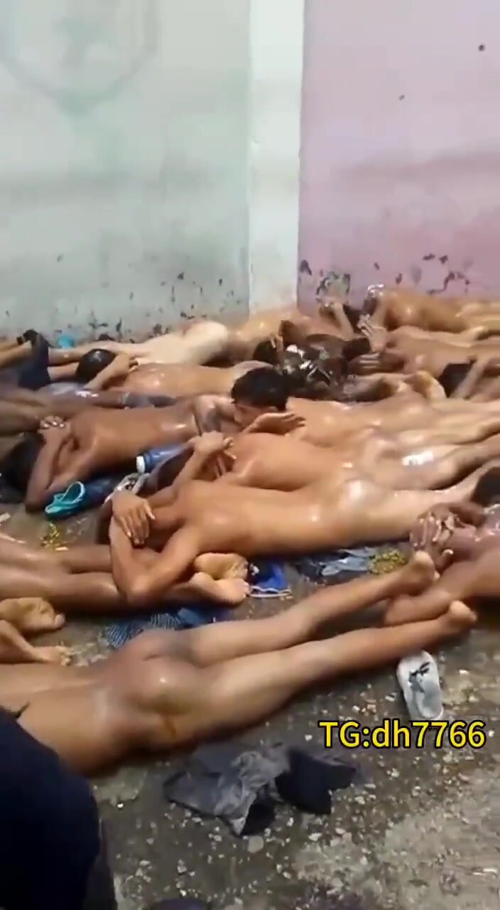 Prisoners lying face down naked