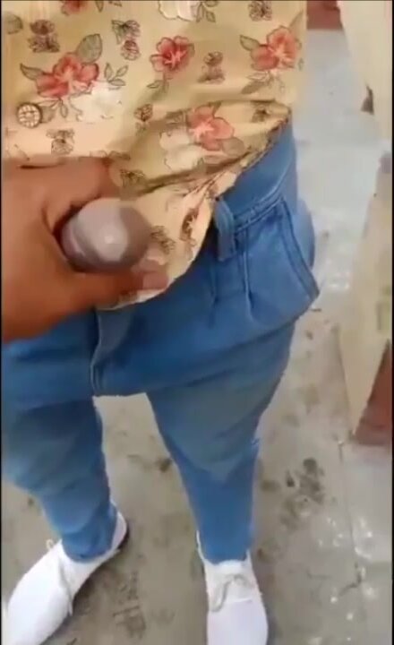 Indian earns money behind public urinal