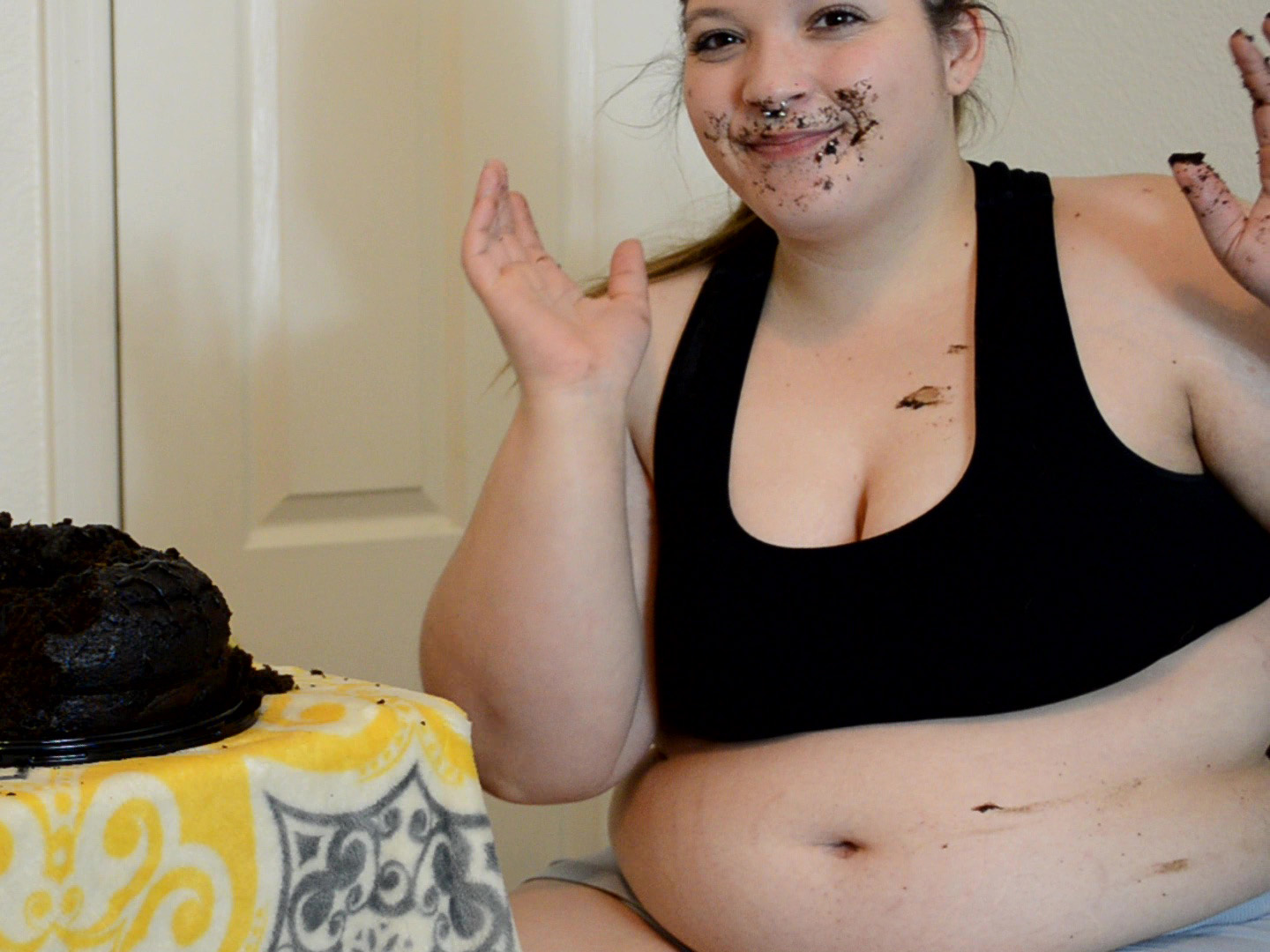 Young fatty eats chocolate cake