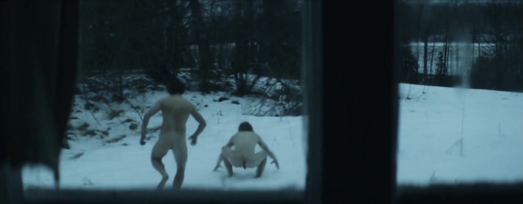 TWO MEN PLAY IN SNOW AFTER SAUNA