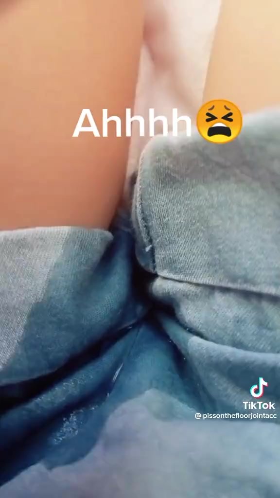 girl pees denim shorts in bed