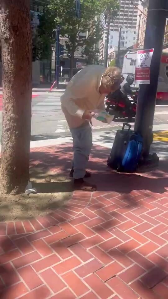 Homeless guy wiping his ass in the public