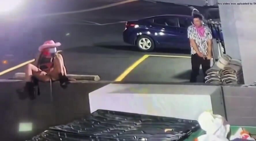 Couple caught relieving themselves in the parking lot
