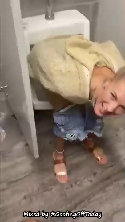 Girl hovers in urinal peeing *tik tok style vid