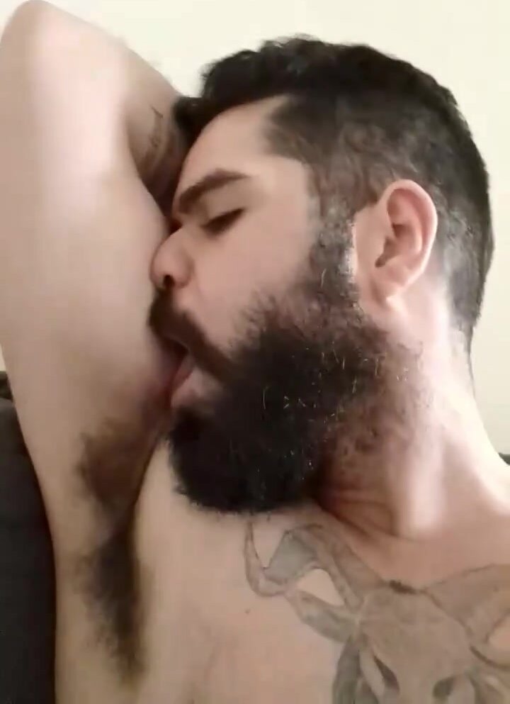 Hairy bearded hunk sniffing own pit