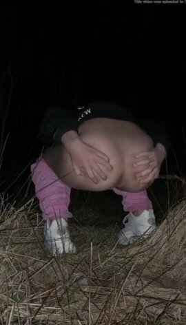 Young blonde poops outdoors at night