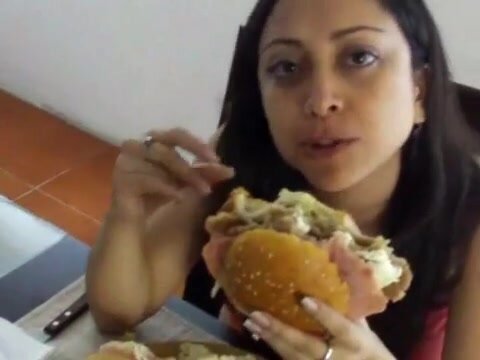 girl eats mexican sandwich