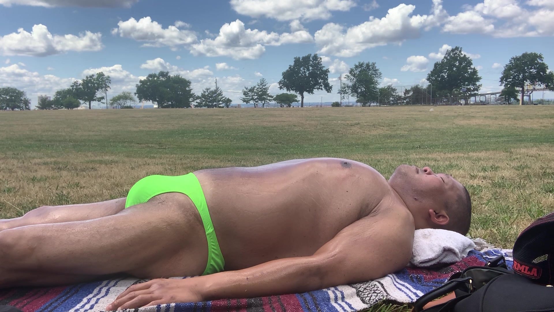 Sunbathing in green bikini
