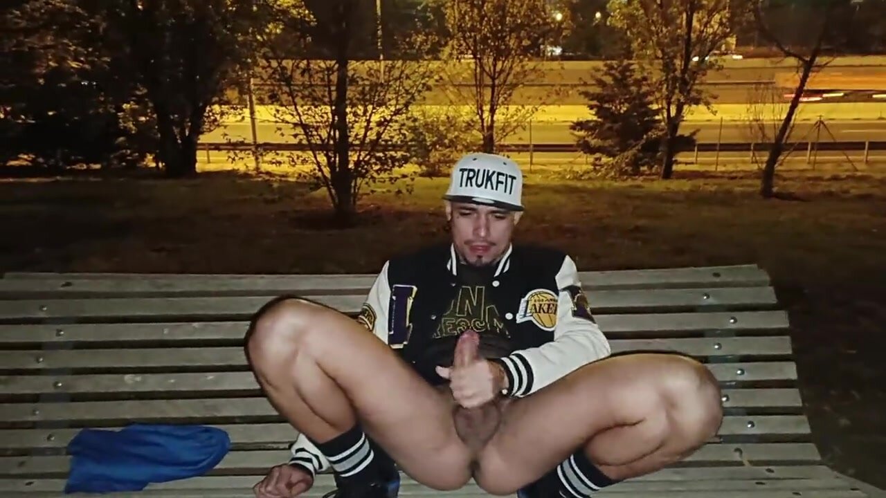Fit guy enjoys a wank at night on a park bench