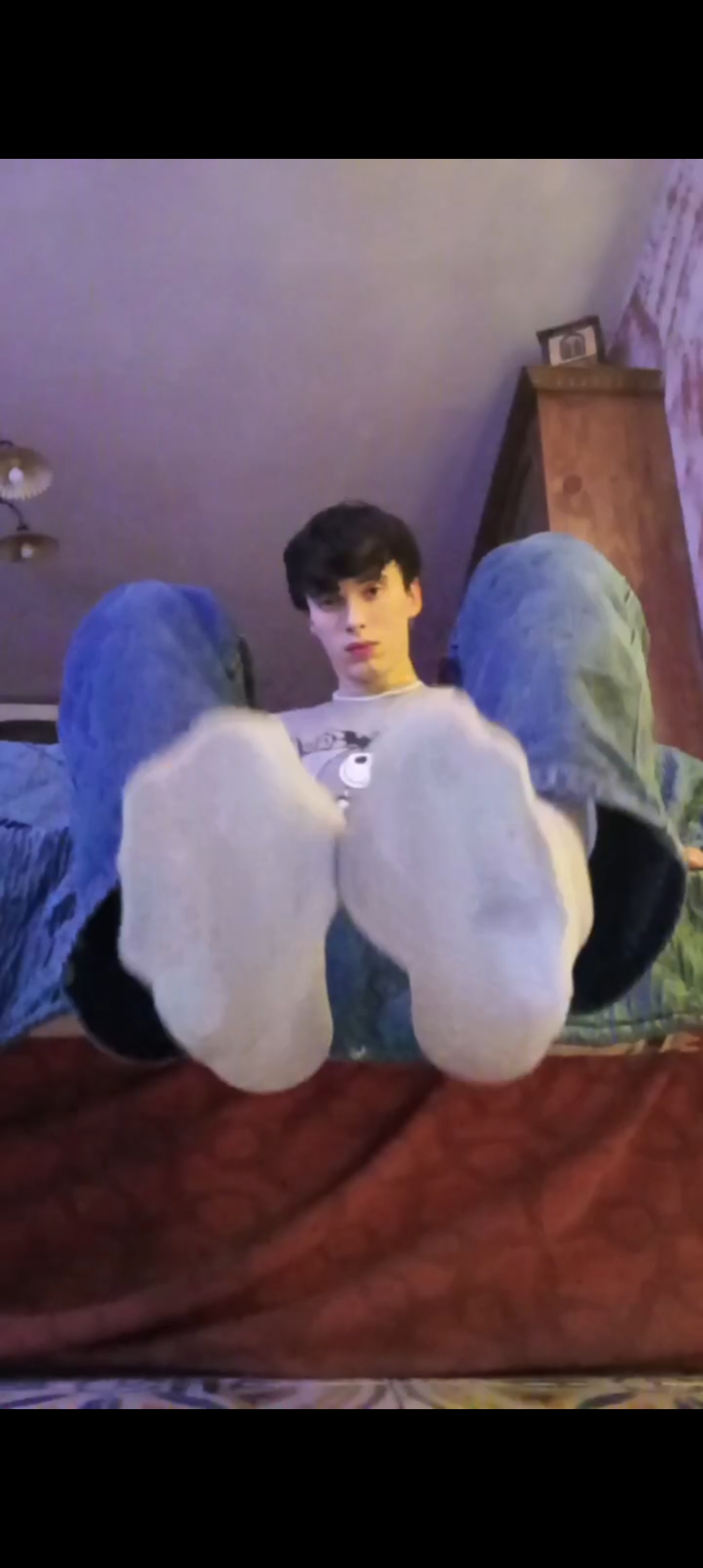 Cute guy licks his own feet