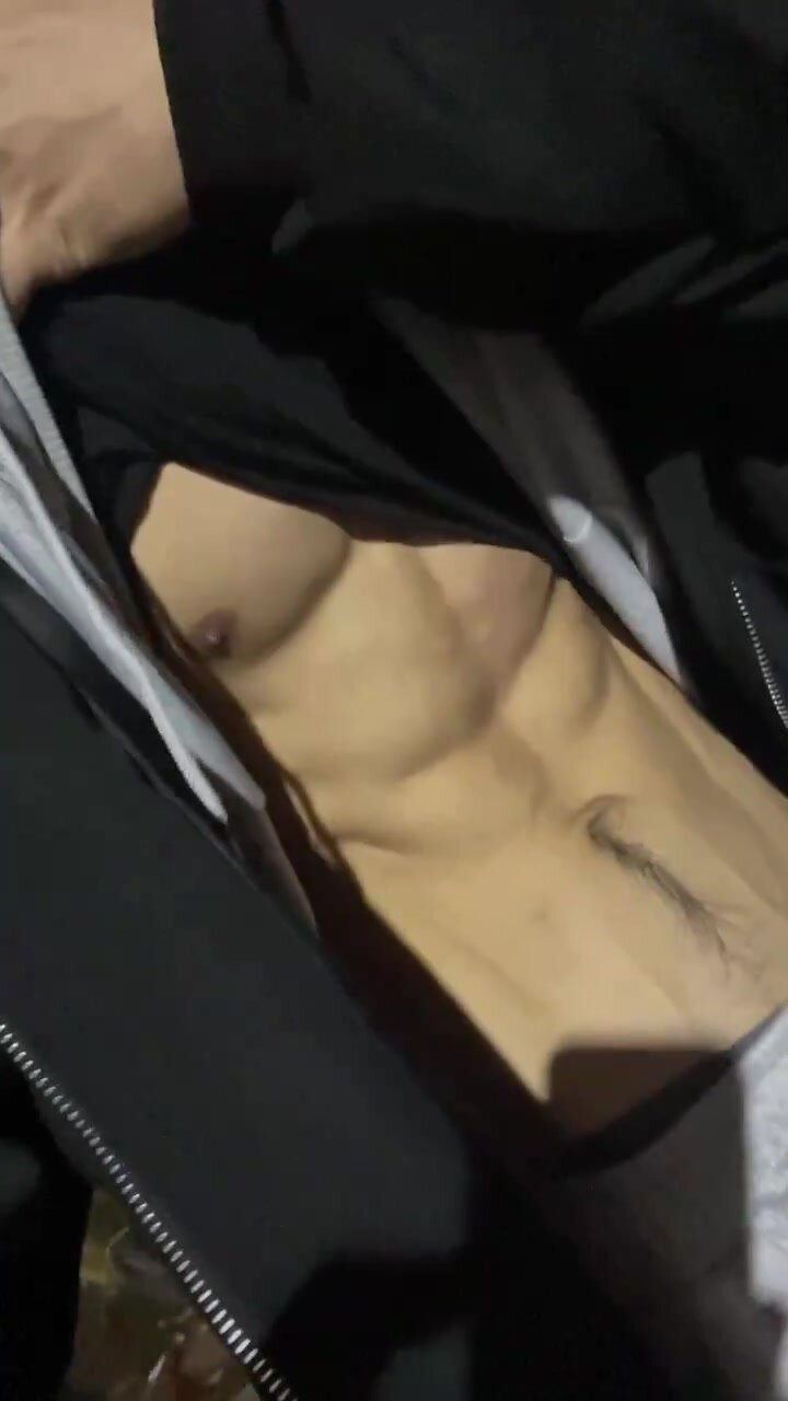 Cute Asian boy showing ripped abs