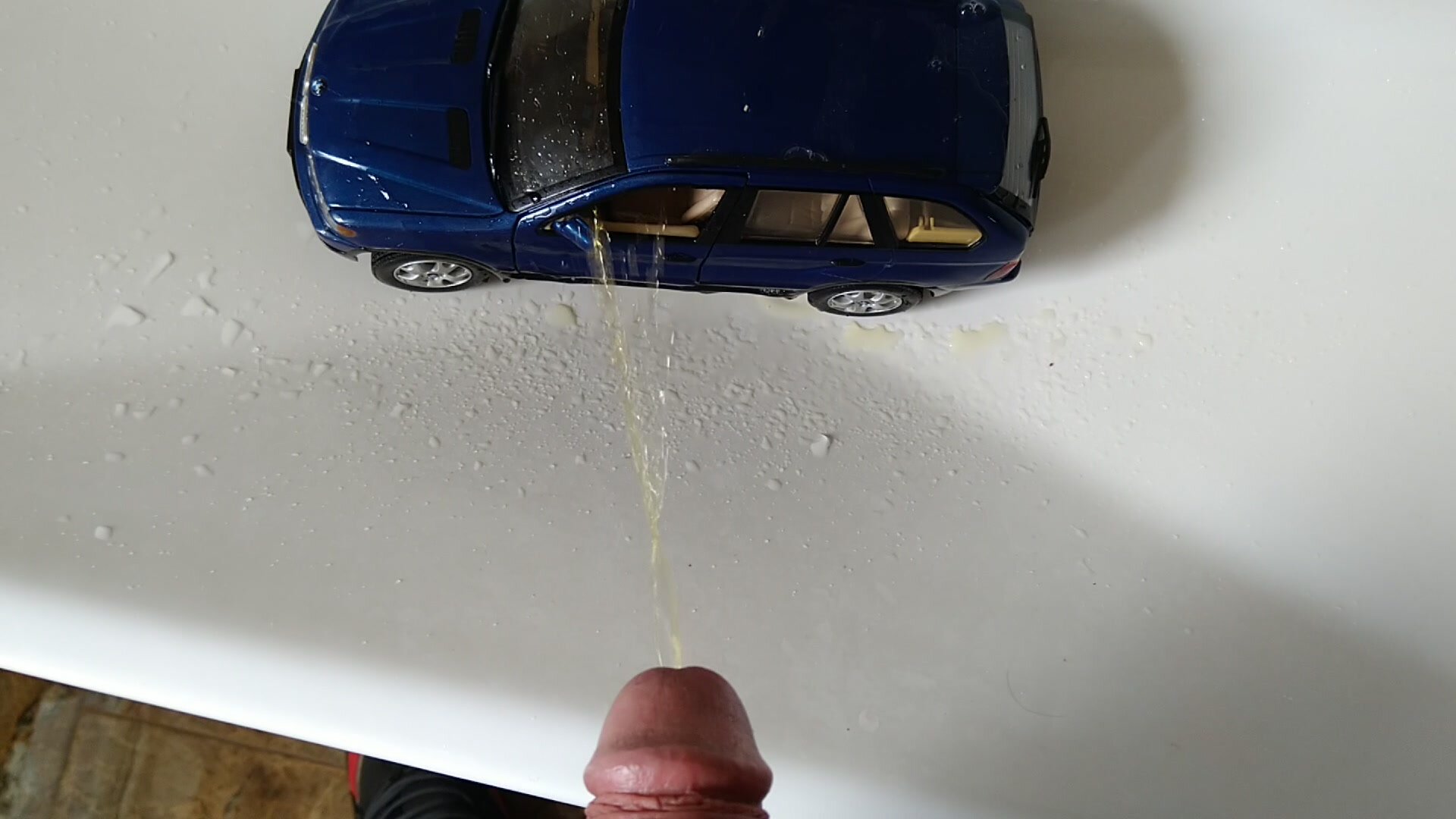 Piss in a toy BMW