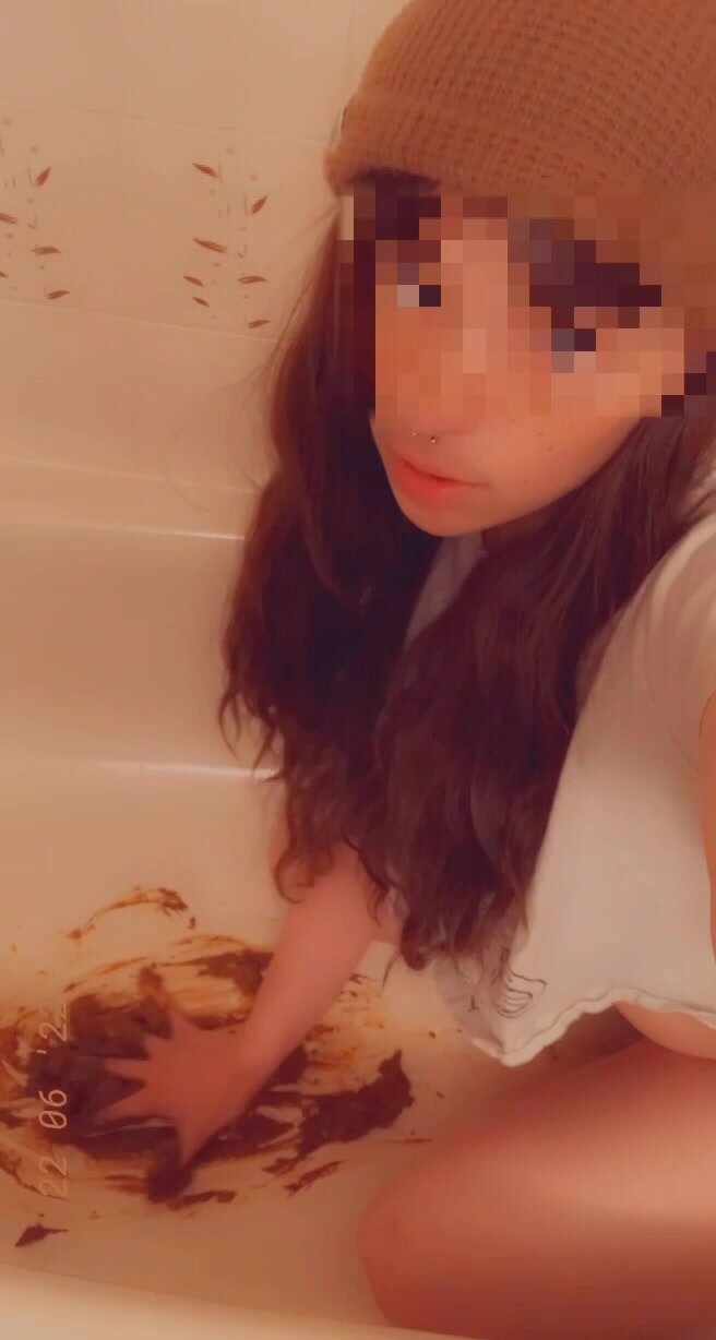 Sexy girl eats her shit in a bathtub