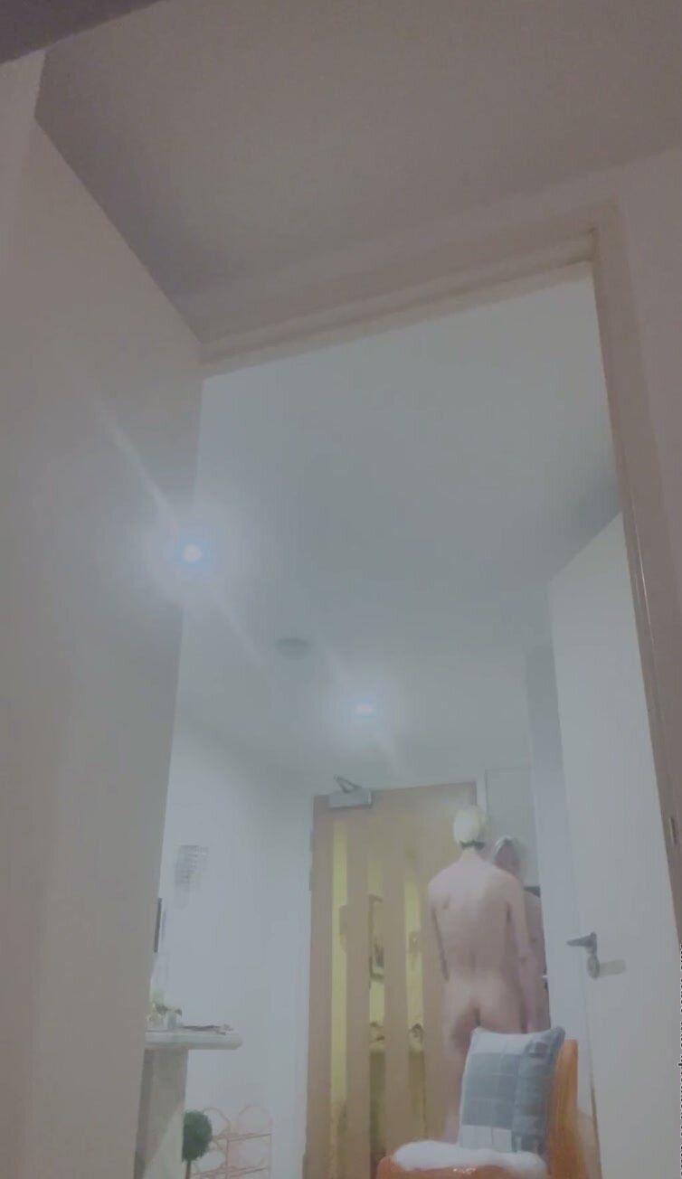 Tall guy answers door naked