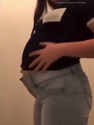 Girl huge belly in tight short