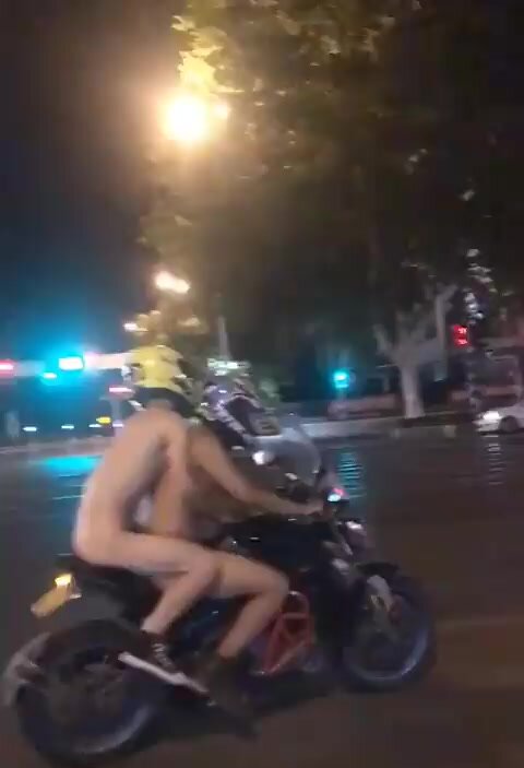 2 Naked guys on a motorcycle