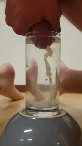Cumming in water glass