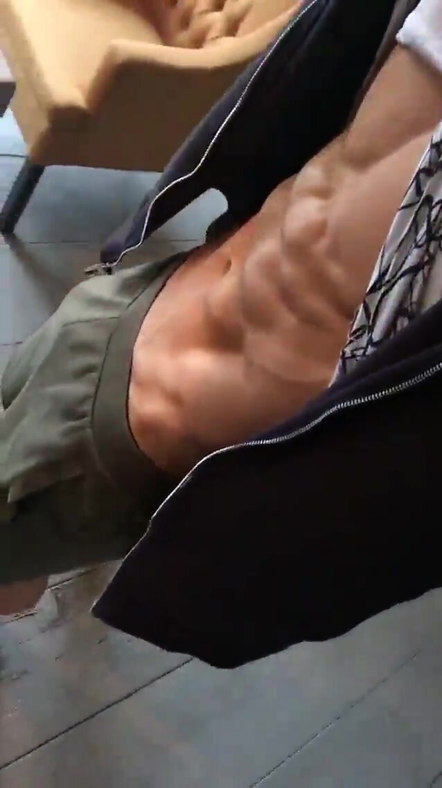 Cocky blond young jock flexes and shows abs