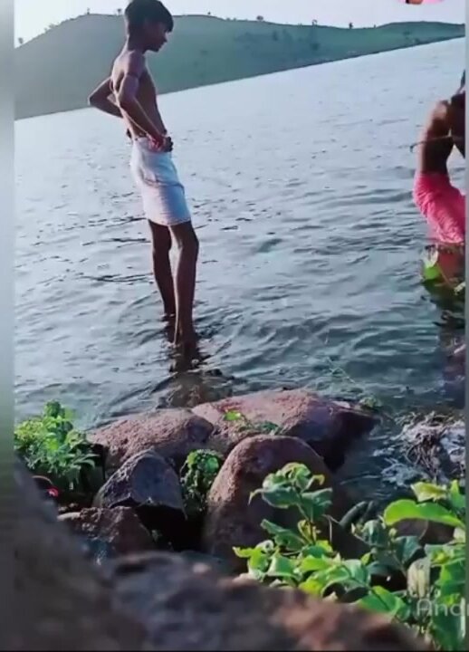 Indian friends swimming in the river