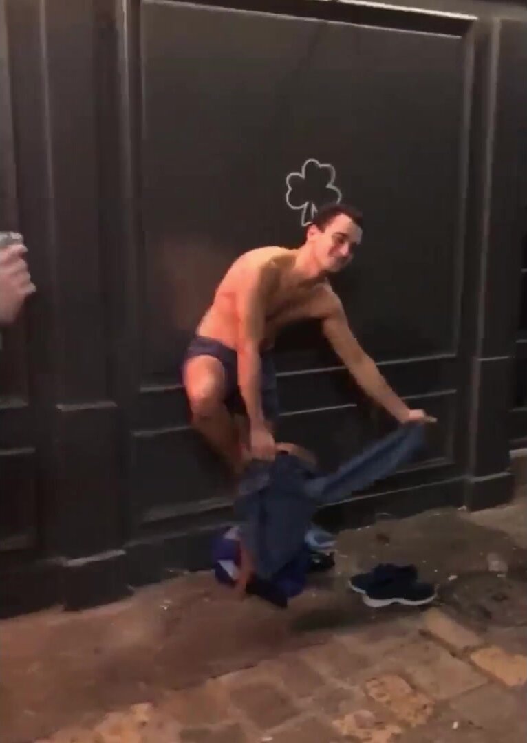 guy strips on the street