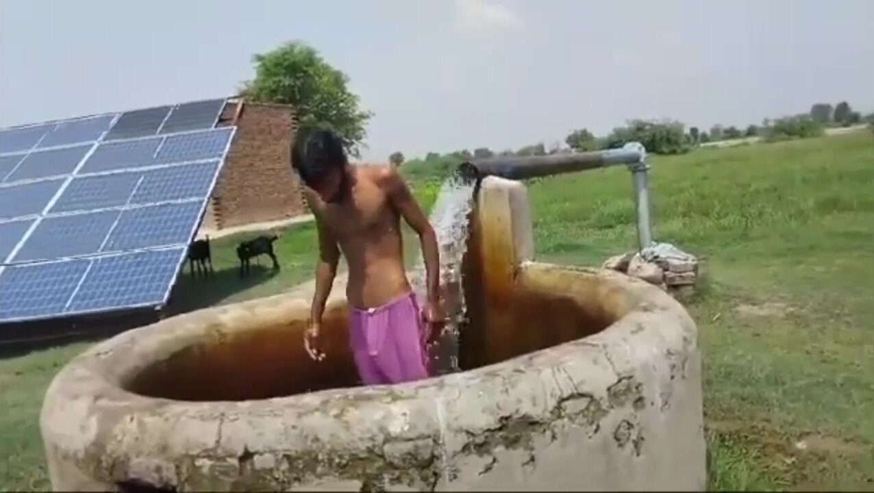 Slim villager in tubewell