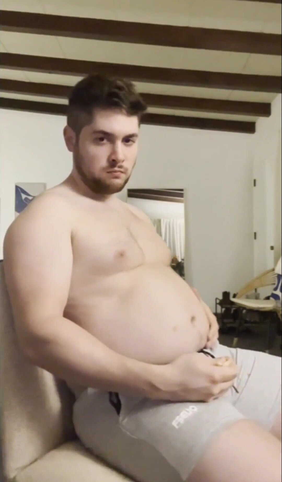 Jiggles his belly .