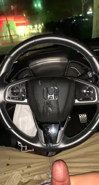 Guy shoots cum inside car on wheel