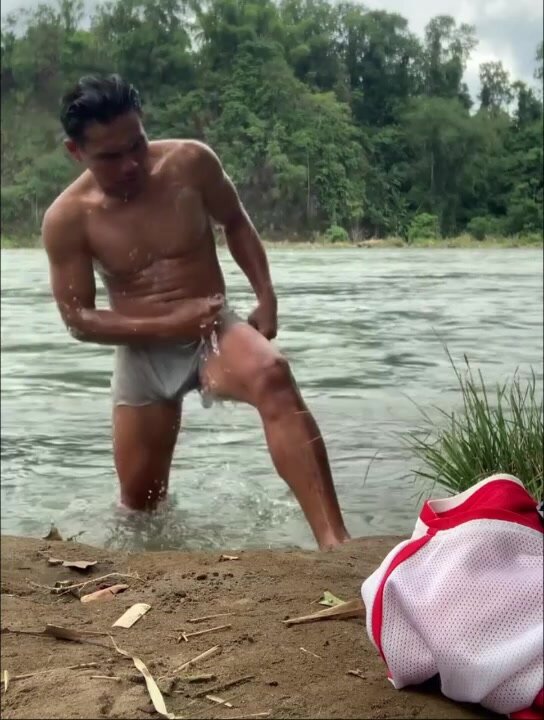 Philipinese villager bathing in the river