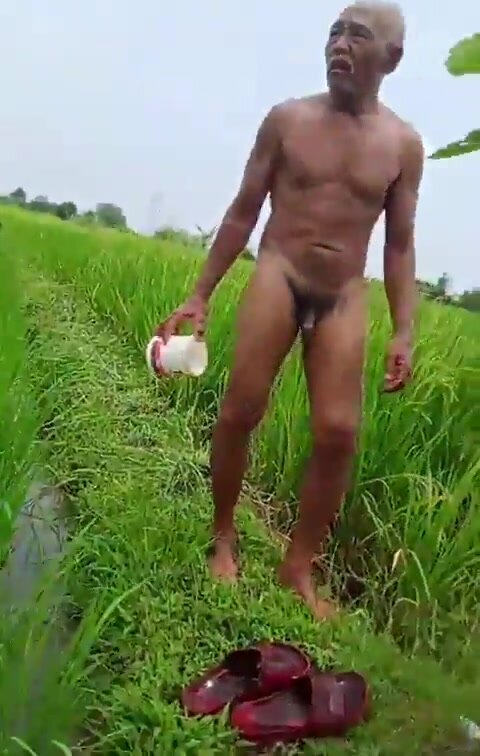 Mature Asian man caught bathing