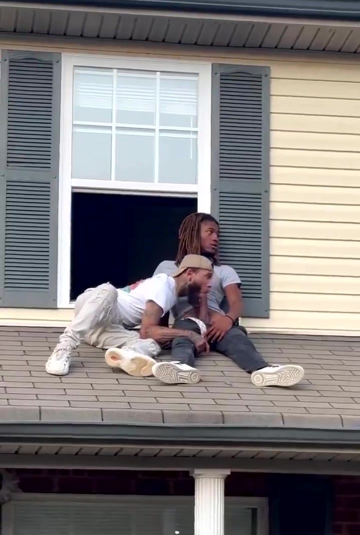 Sucking cock on the roof