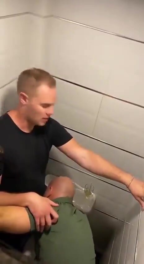 Four Guys in Tight Bathroom Stall