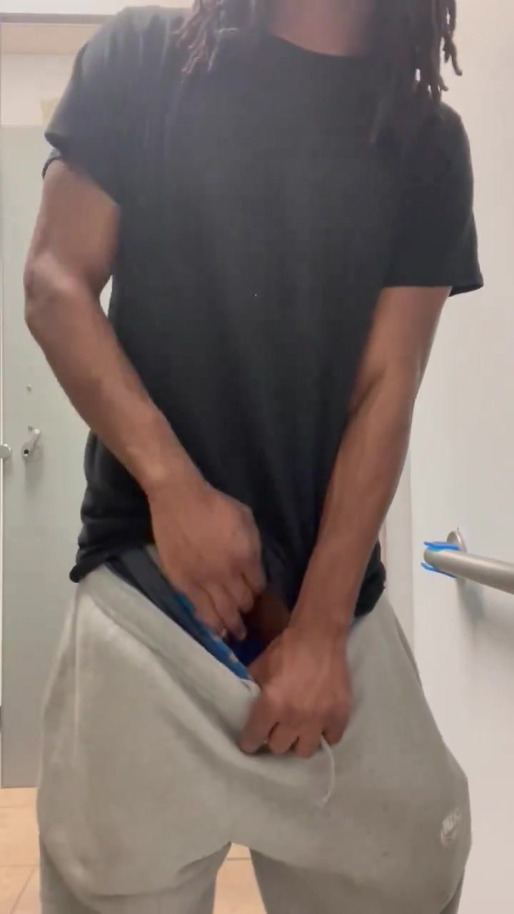 Playing with dick in public bathroom